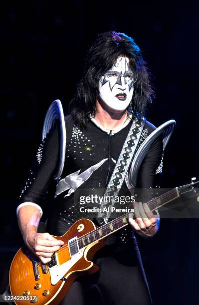 Tommy Thayer and rock group Kiss performs at Jones Beach on August 6, 2003 in Wantaugh, New York.