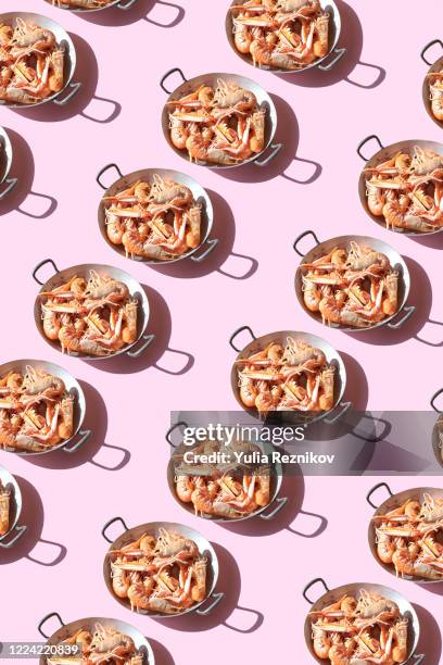 crawfish in a pan on the pink background - pate stock pictures, royalty-free photos & images