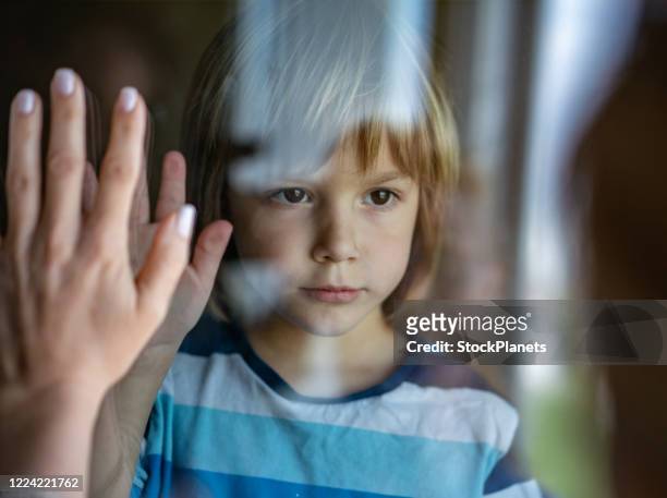 little boy says goodbye before mom goes on work - goodbye single word stock pictures, royalty-free photos & images