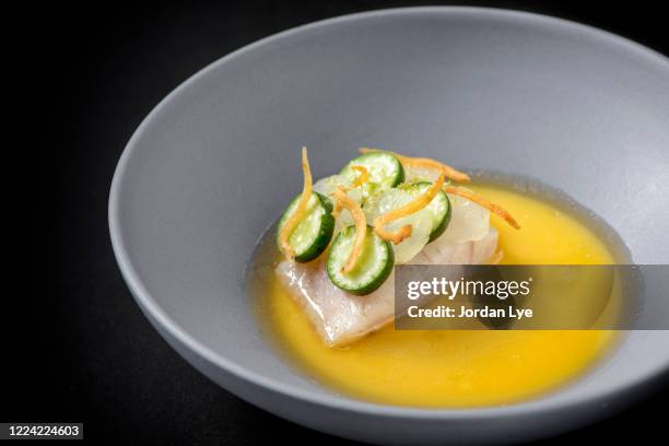 seabass with pouring shaoxing broth - course meal stock pictures, royalty-free photos & images