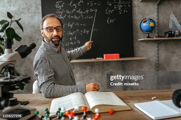 male professor teaching on blackboard in class - zoom classroom stock pictures, royalty-free photos & images