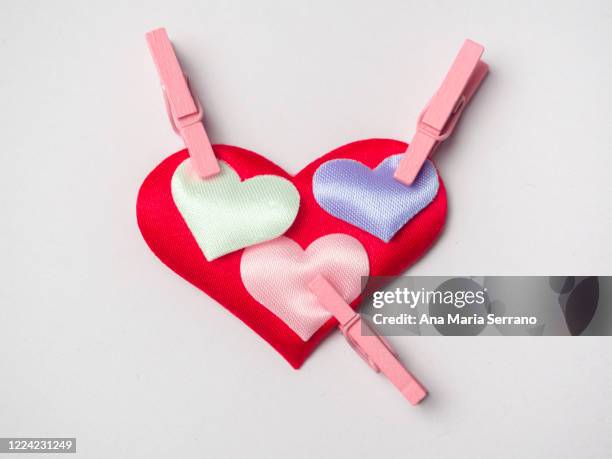 hearts attached with clothespins. love concept - polygamy ストックフォトと画像