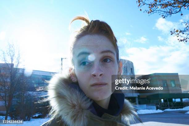 portrait of a teenage girl on a college campus. tight shot of just her head. back lit with a sun flair and the shot is a cool blue color. she is looking off camera. - college visit stock pictures, royalty-free photos & images