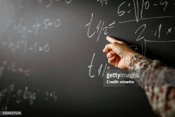 Math Pointing 505 Hand Pointing To Board Stock Photos, High-Res Pictures, and Images ...
