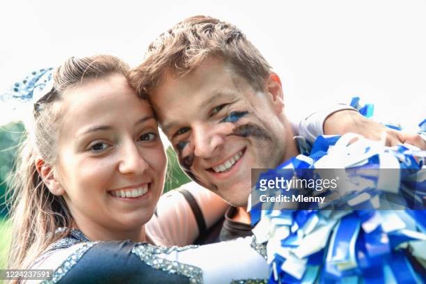 american football player and cheerleader girl in love - girl american football player stock pictures, royalty-free photos & images