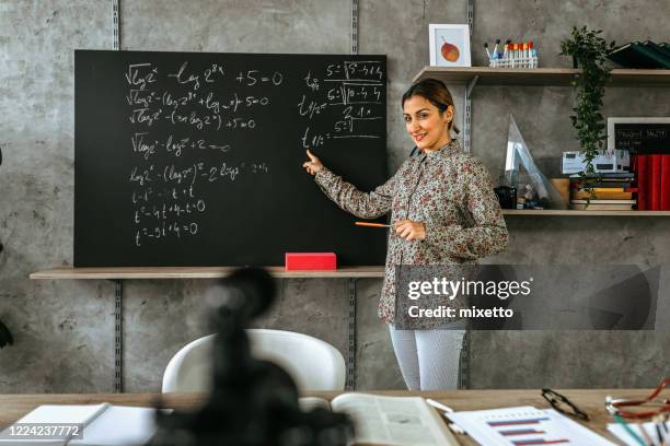 woman recording educational video for her vlog on camera - teacher pointing finger stock pictures, royalty-free photos & images
