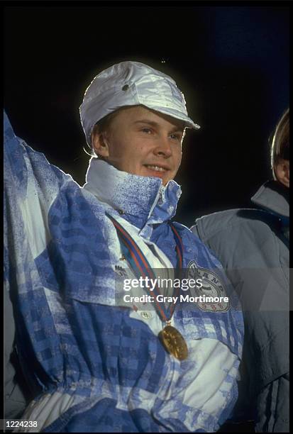 MATTI NYKANEN OF FINLAND WAVES TO THE CROWD AFTER RECEIVING HIS GOLD MEDAL FOR THE 70 METRE SKI-JUMPING COMPETITION AT THE 1988 WINTER OLYMPICS IN...