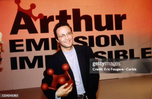 Tv host, L'Animateur Arthur poses during a portrait session in Paris, France on .