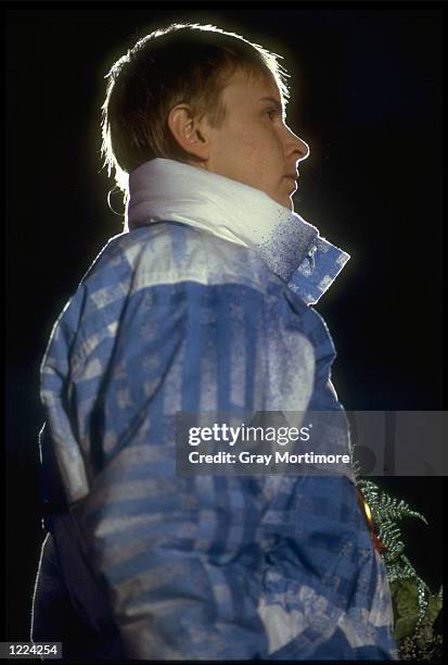 MATTI NYKANEN OF FINLAND LISTENS TO THE NATIONAL ANTHEM AFTER CLAIMING THE GOLD MEDAL IN THE MENS 70 METRE SKI-JUMPING COMPETITION AT THE 1988 WINTER...