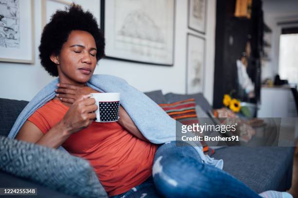 adult woman at home, being sick - symptom stock pictures, royalty-free photos & images