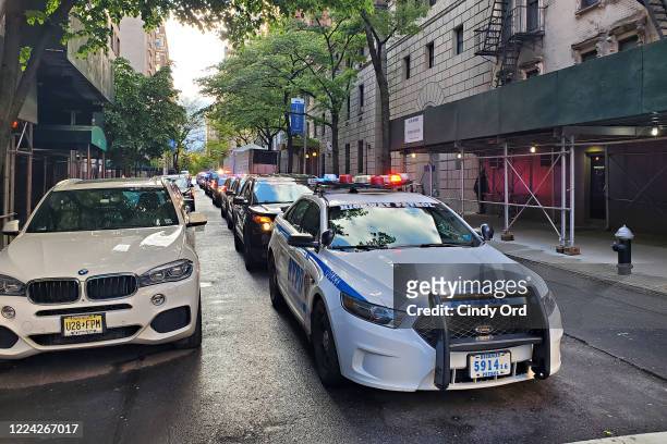 Police motorcade arrives at the makeshift morgue at Lenox Hill Hospital to escort the body of Glen Ridge New Jersey police officer Charles Roberts on...