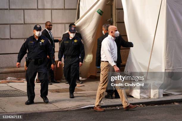 Officers exit the makeshift morgue at Lenox Hill Hospital before escorting the body of Glen Ridge New Jersey police officer Charles Roberts on May...