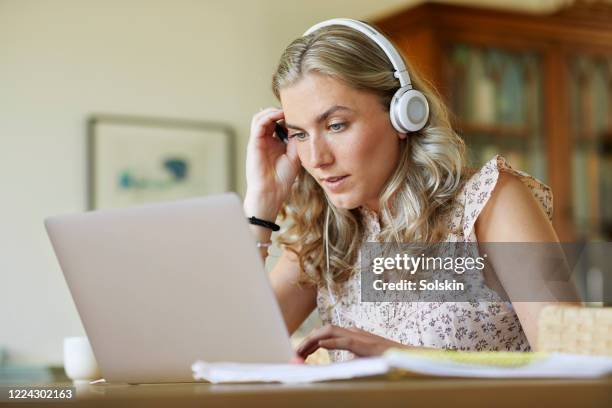 young woman making schoolwork from home - online university stock pictures, royalty-free photos & images