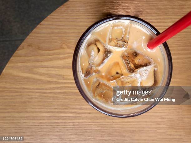 iced cafe latte - straw ストックフォトと画像