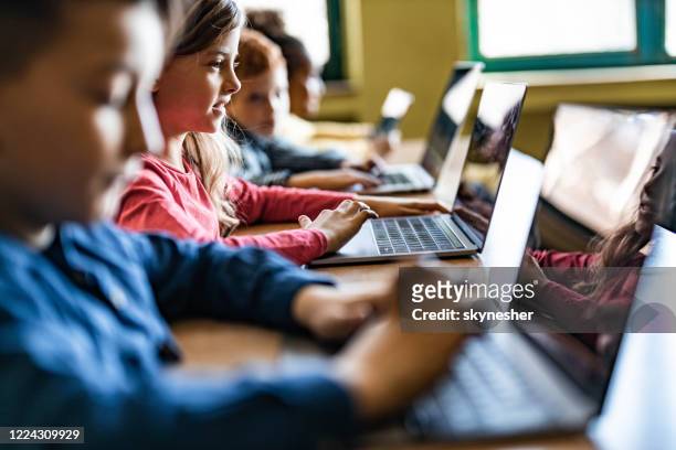 digital native students e-learning over computers at school. - elementary school building stock pictures, royalty-free photos & images