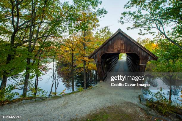 old covered bridge in new england fall - stowe vermont stock pictures, royalty-free photos & images