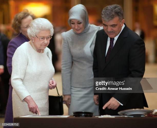 Queen Elizabeth II, President of Turkey Abdullah Gul and his wife Hayrunnisa tour an exhibition of Turkish Artefacts from the Royal collection in the...