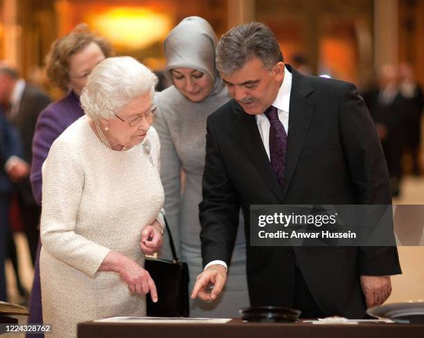 Queen Elizabeth II, President of Turkey Abdullah Gul and his wife Hayrunnisa tour an exhibition of Turkish Artefacts from the Royal collection in the...