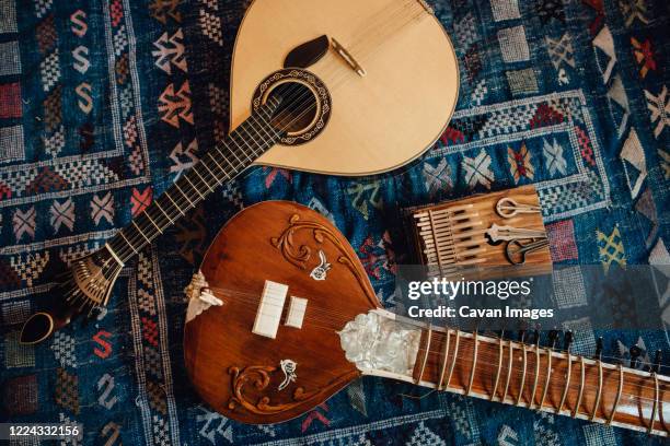 traditional musical instruments: sitar, portuguese guitar, kalimba - sitar stockfoto's en -beelden