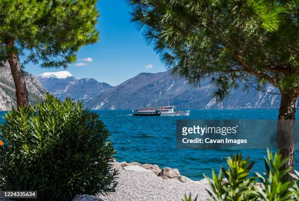 ferry on lago di garda lake in italy - riva del garda stock pictures, royalty-free photos & images