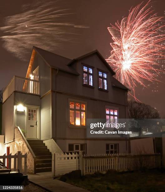 traditional house in downtown reykjavik on new year's eve - suburban downtown stock pictures, royalty-free photos & images