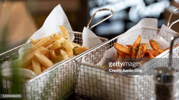 french fries, sweet potato fries - sweet potato fries stock pictures, royalty-free photos & images
