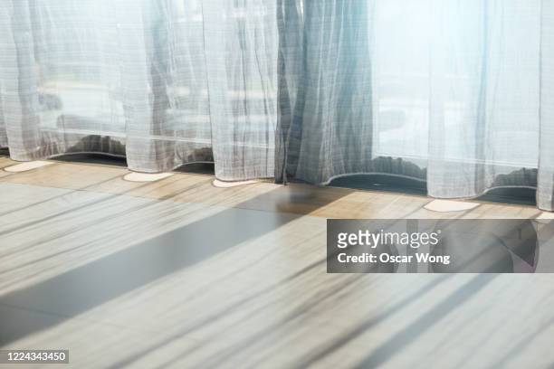 close-up shot of sunlight comes through the curtain during the day - morning window stock pictures, royalty-free photos & images