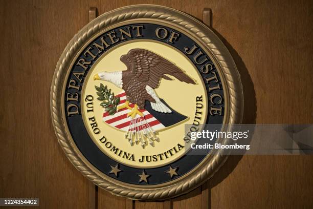 The U.S. Department of Justice seal is displayed on a podium during a news conference at the U.S. Attorney's Office in New York, U.S., on Thursday,...