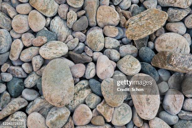 round stones at a sea beach - 玉砂利 ストックフォトと画像