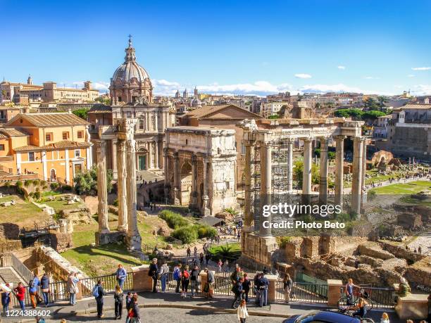 the roman forum with the triumphal arch of septimius severus in rome seen from the terrace of the campidoglio - ancient civilisation roman stock pictures, royalty-free photos & images