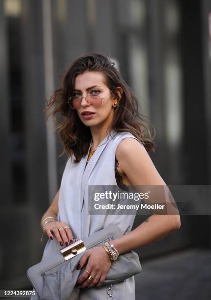 Masha Sedgwick wearing Gestuz bag and Cos dress on May 06, 2020 in Berlin, Germany.