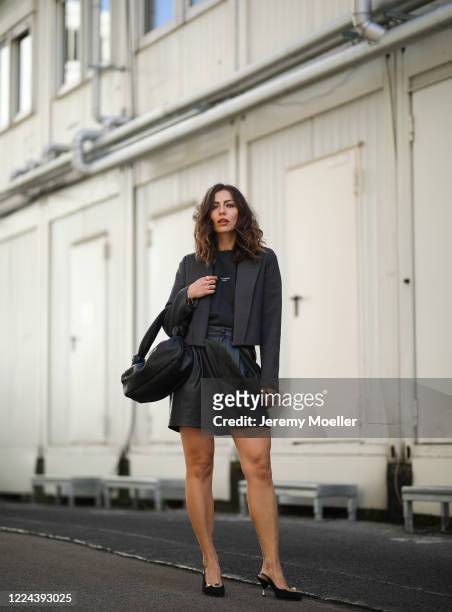 Masha Sedgwick wearing Acne Studios shirt, Maison Margiela blazer, Set pants and Miu Miu bag and heels on May 06, 2020 in Berlin, Germany.