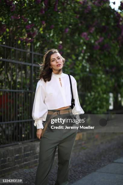 Masha Sedgwick wearing Lala Berlin bag, Nobi Talai shirt and Munthe pants on May 06, 2020 in Berlin, Germany.