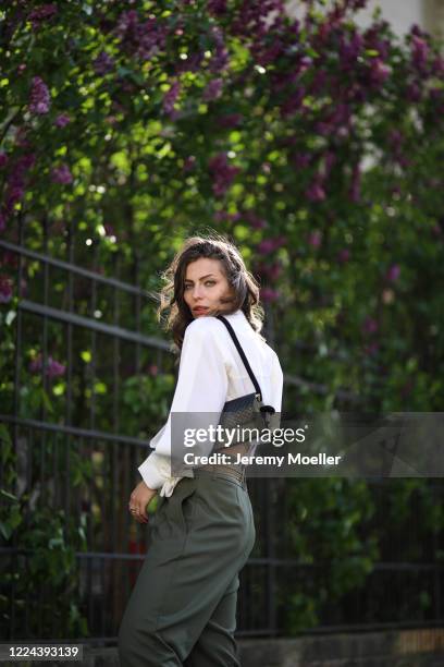 Masha Sedgwick wearing Lala Berlin bag, Nobi Talai shirt and Munthe pants on May 06, 2020 in Berlin, Germany.