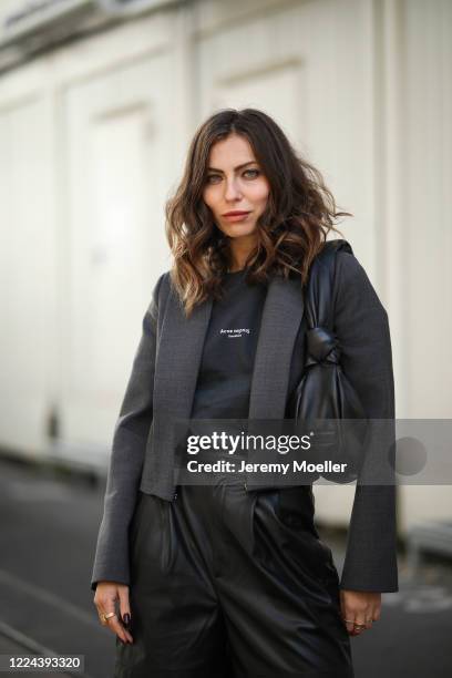 Masha Sedgwick wearing Acne Studios shirt, Maison Margiela blazer, Set pants and Miu Miu bag on May 06, 2020 in Berlin, Germany.