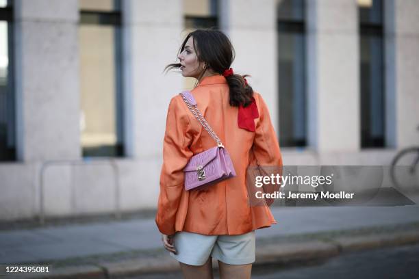 Masha Sedgwick wearing Copenhagen Muse pants, Acne Studios shirt, Baum & Pferdgarten Blazer and Miu Miu bag on May 06, 2020 in Berlin, Germany.