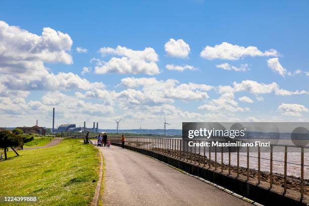 wind turbines at severn beach, bristol, uk - river bank stock pictures, royalty-free photos & images