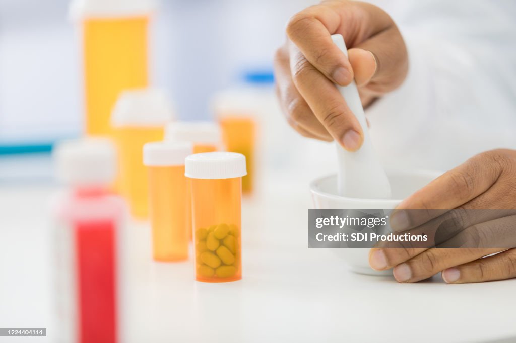 Pharmacist mixed medication in compounding pharmacy