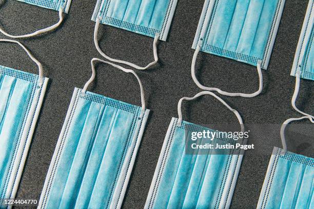 looking down onto blue surgical face masks - n95 face mask - fotografias e filmes do acervo