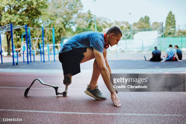 man with prosthetic leg on running outdoors - right winger athlete stock pictures, royalty-free photos & images