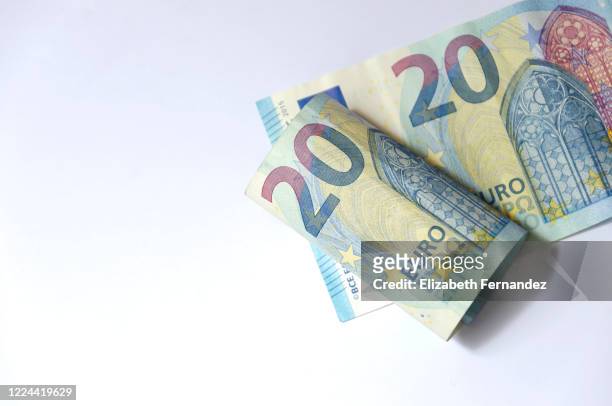 twenty euro bank notes on white background, copy space - twenty euro banknote stock pictures, royalty-free photos & images