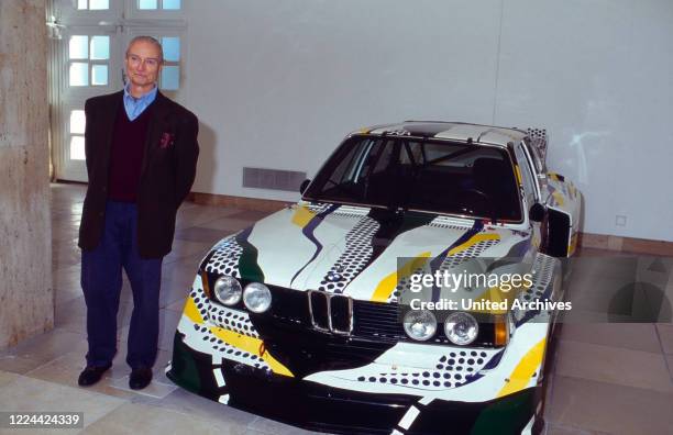 American pop art artist Roy Lichtenstein with a BMW sports car designed by himself, at the opening of a retrospective exhibition at Haus der Kunst in...