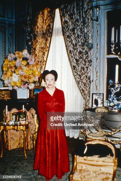The Duchess of Windsor, Wallis Simpson, with her pug dogs at her home in Bois de Boulogne near Paris, France 1974.