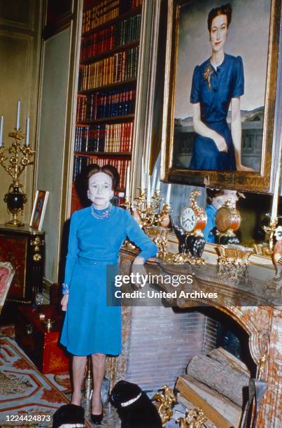 The Duchess of Windsor, Wallis Simpson, with her pug dogs at her home in Bois de Boulogne near Paris, France 1974.