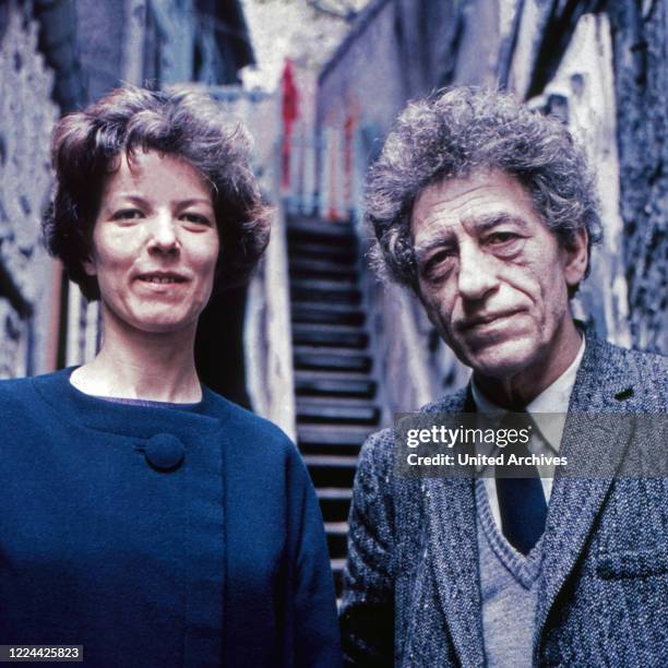 Swiss sculptor, painter and graphic artist Alberto Giacometti with Annette Arm at his studio in Paris, France 1962.