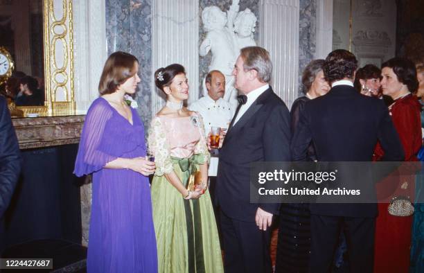 Queen Silvia of Sweden talking to Johannes Rau and his wife Christina, nee Delius, at Bonn, Germany, 1984.