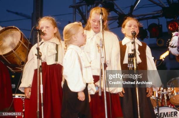 Singing group "The Kelly Family" performing live with father Dan Kelly at Duesseldorf, Germany, 1989.