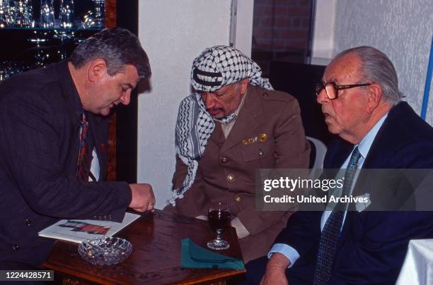 Joseph Martin Joschka Fischer, PLO leader Yasser Arafat and Hans Juergen Wischnewski at Bonn, Germany, 1997.