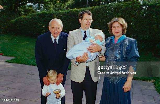 Christian Sigismund of Prussia holding his daughter Princess Irina in his arms, right his wife Princess Nina, nee von Reventlow, and his father Louis...