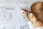UI UX designer drawing new website wireframe